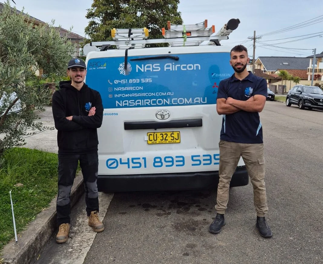 NAS Aircon technicians with the branded service van